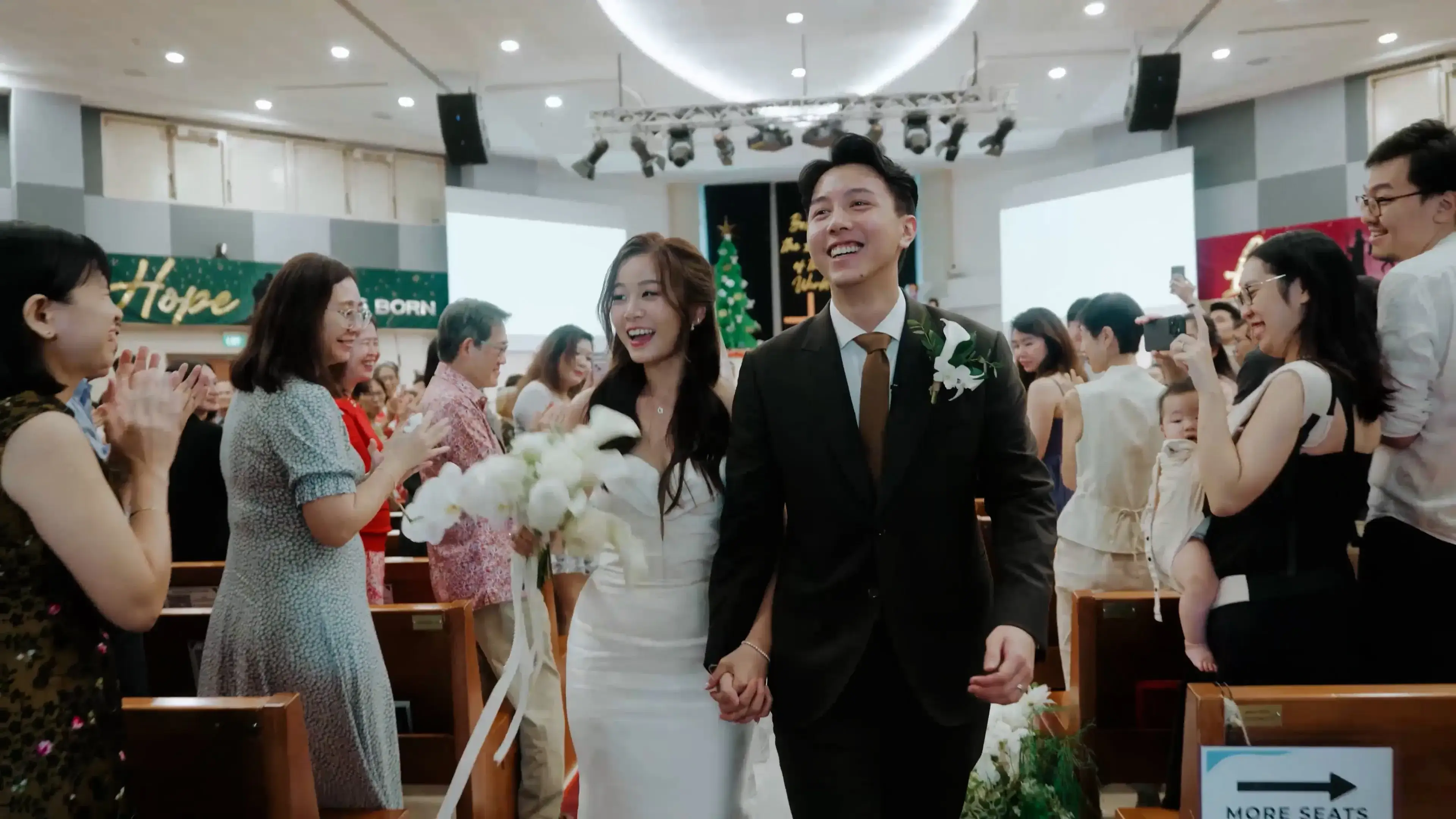 Bride and groom marching out of Ang Mo Kio Methodist Church