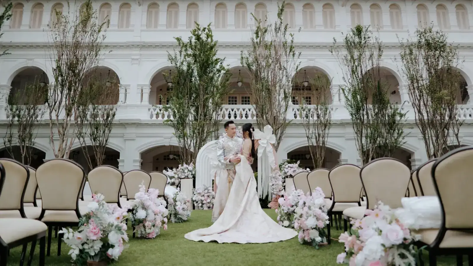 Bride and groom during the outdoor solemnisation at Raffles Hotel Lawn