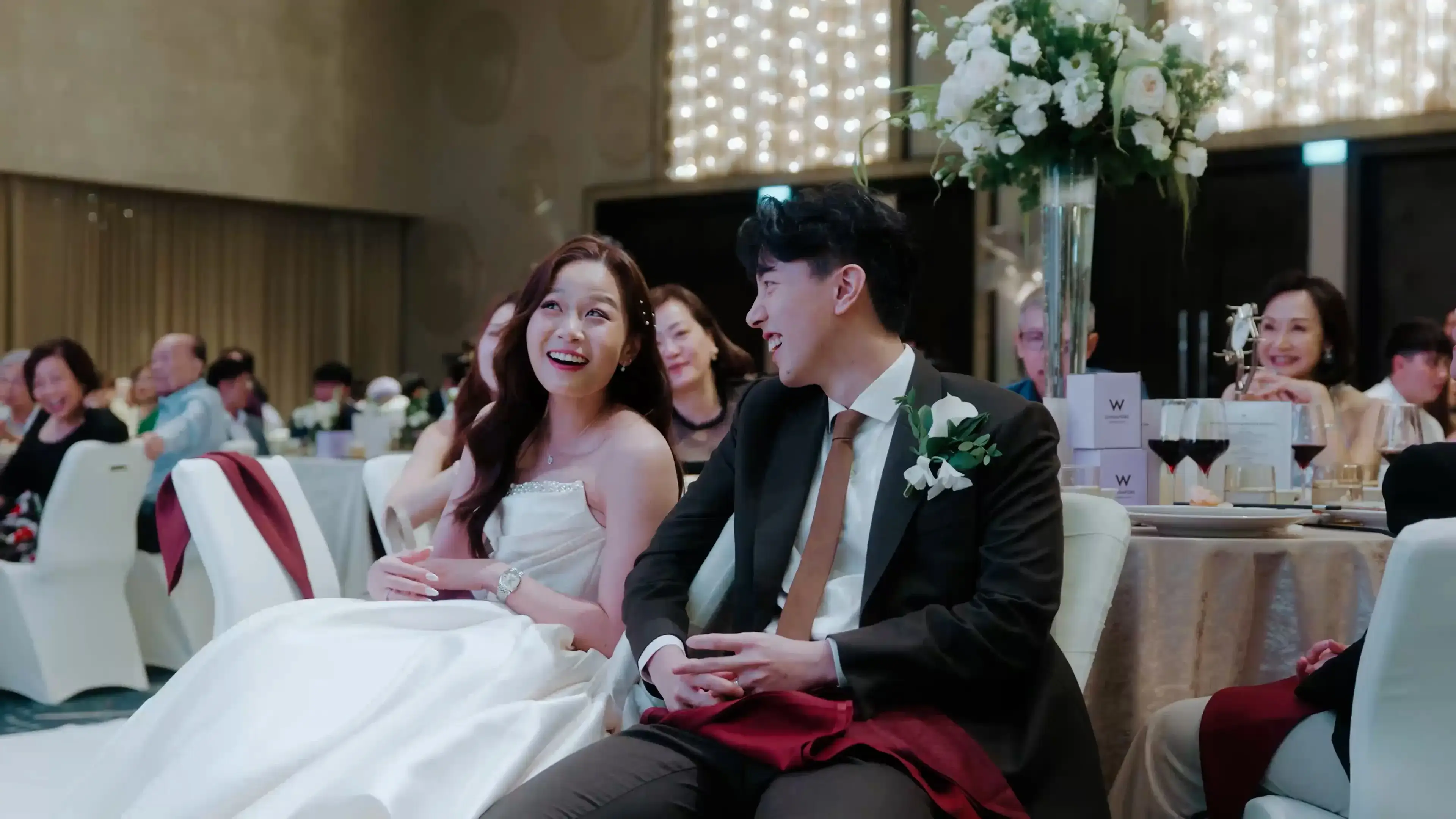 Bride and groom reaction to speech during the W Singapore - Sentosa Cove wedding celebration