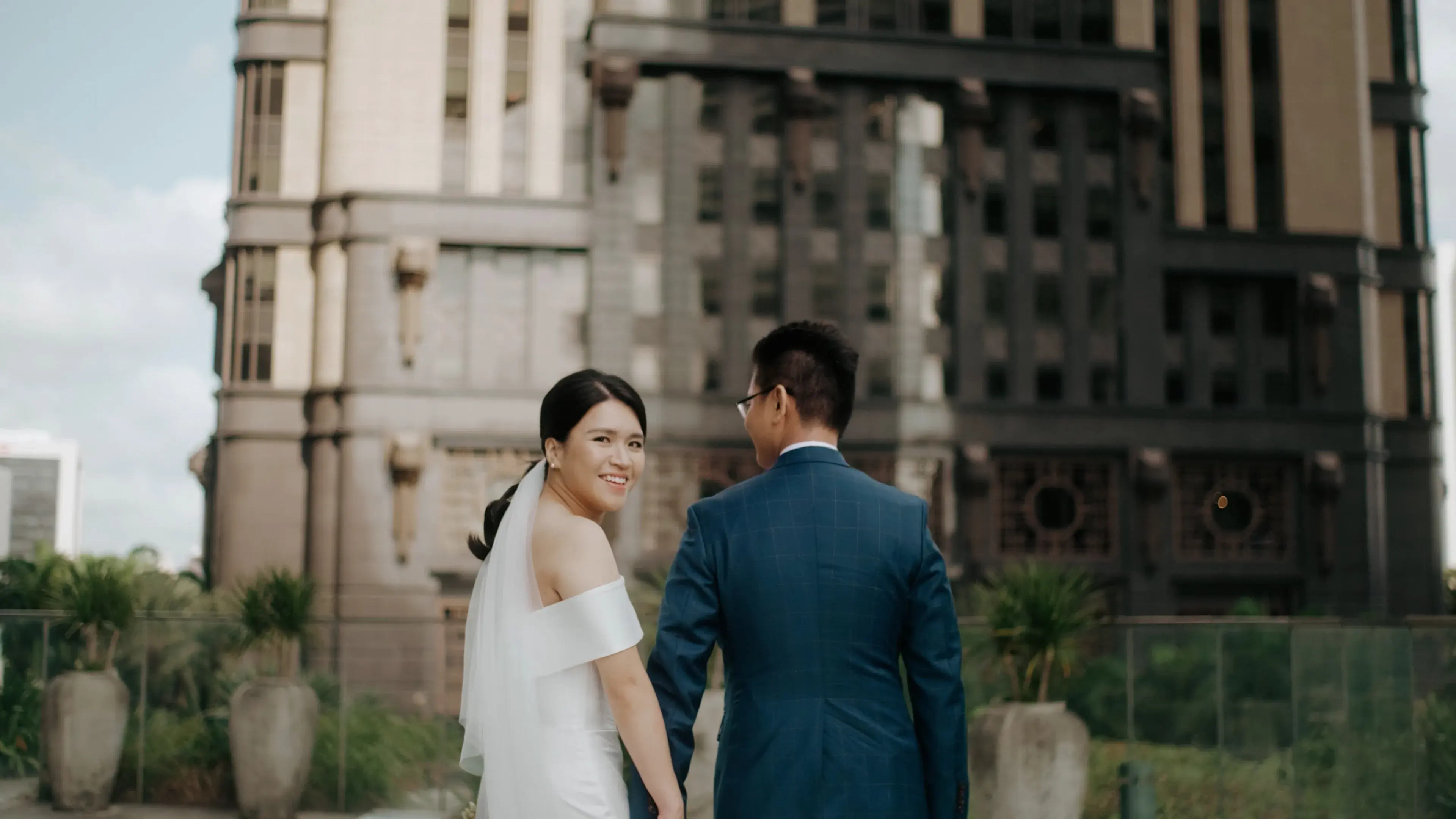 Gee Chuan and Min Xian walking hand in hand at Andaz Garden Studio