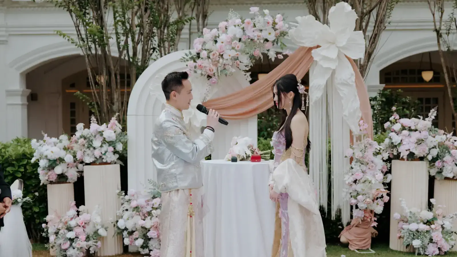 Emotional wedding vows exchange at Raffles Hotel Lawn