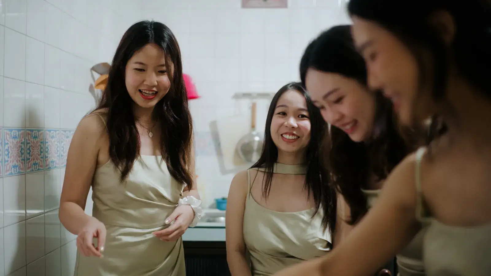 Bridesmaids preparing for the wedding gatecrash at home