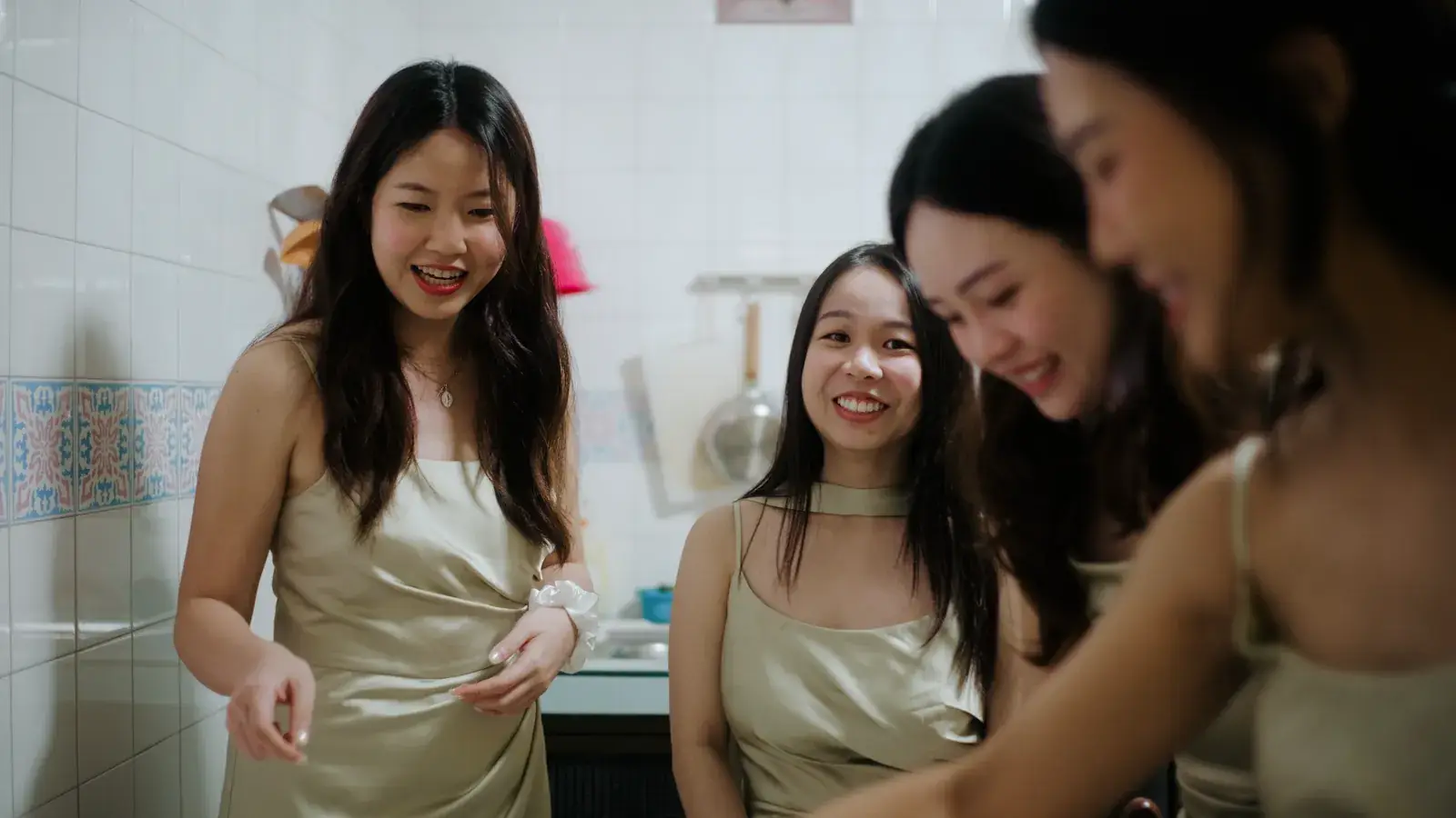 Bridesmaids preparing for the wedding gatecrash at home