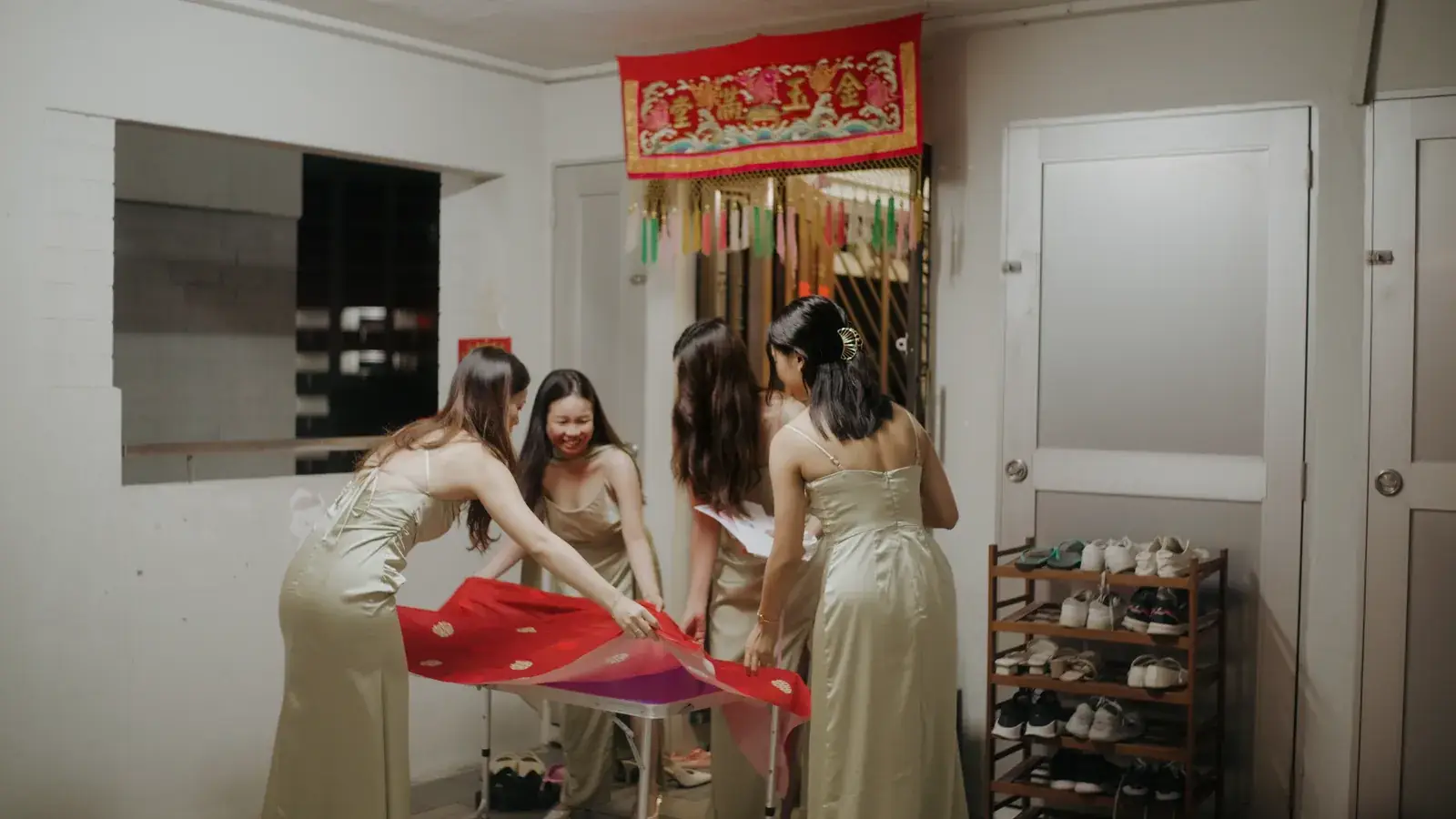 Bridesmaids continuing the gatecrash preparations at the bride’s home