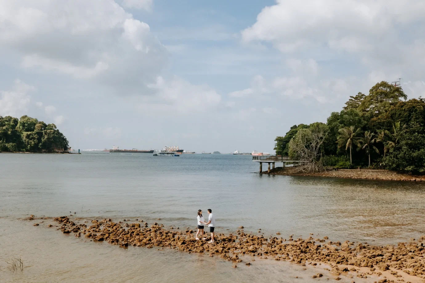 Couple standing by the water for a pre-wedding portrait in Singapore